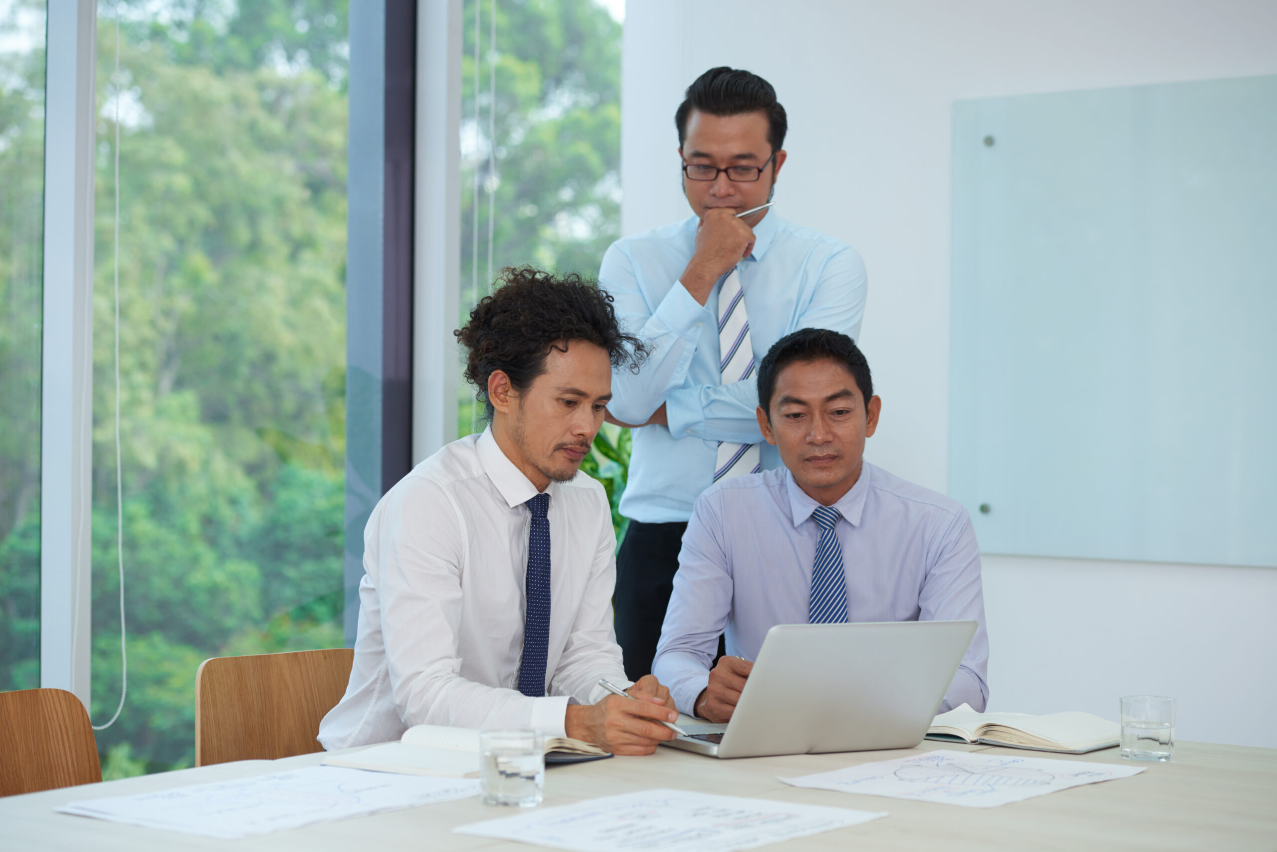 Businessmen discussing the Compliance and Regulations in the Philippines for Outsourcing