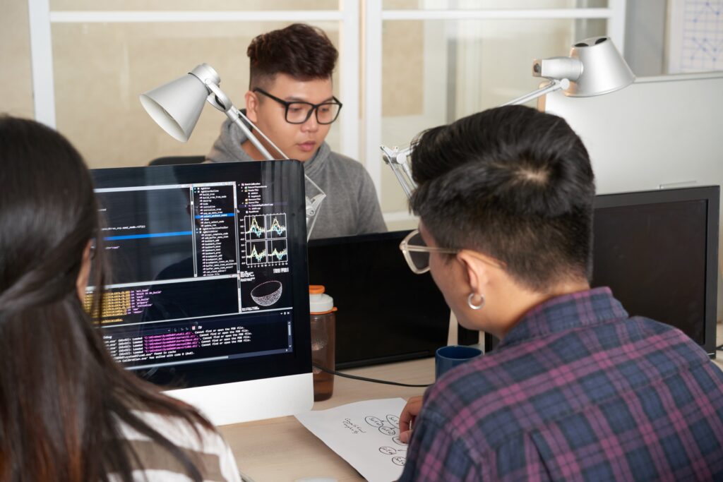 Team Members Looking Up Software Engineer vs Web Developer